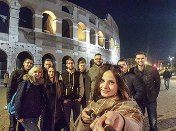 Angle180 team, taking a selfie at the Colosseum after a day of exploring Rome
